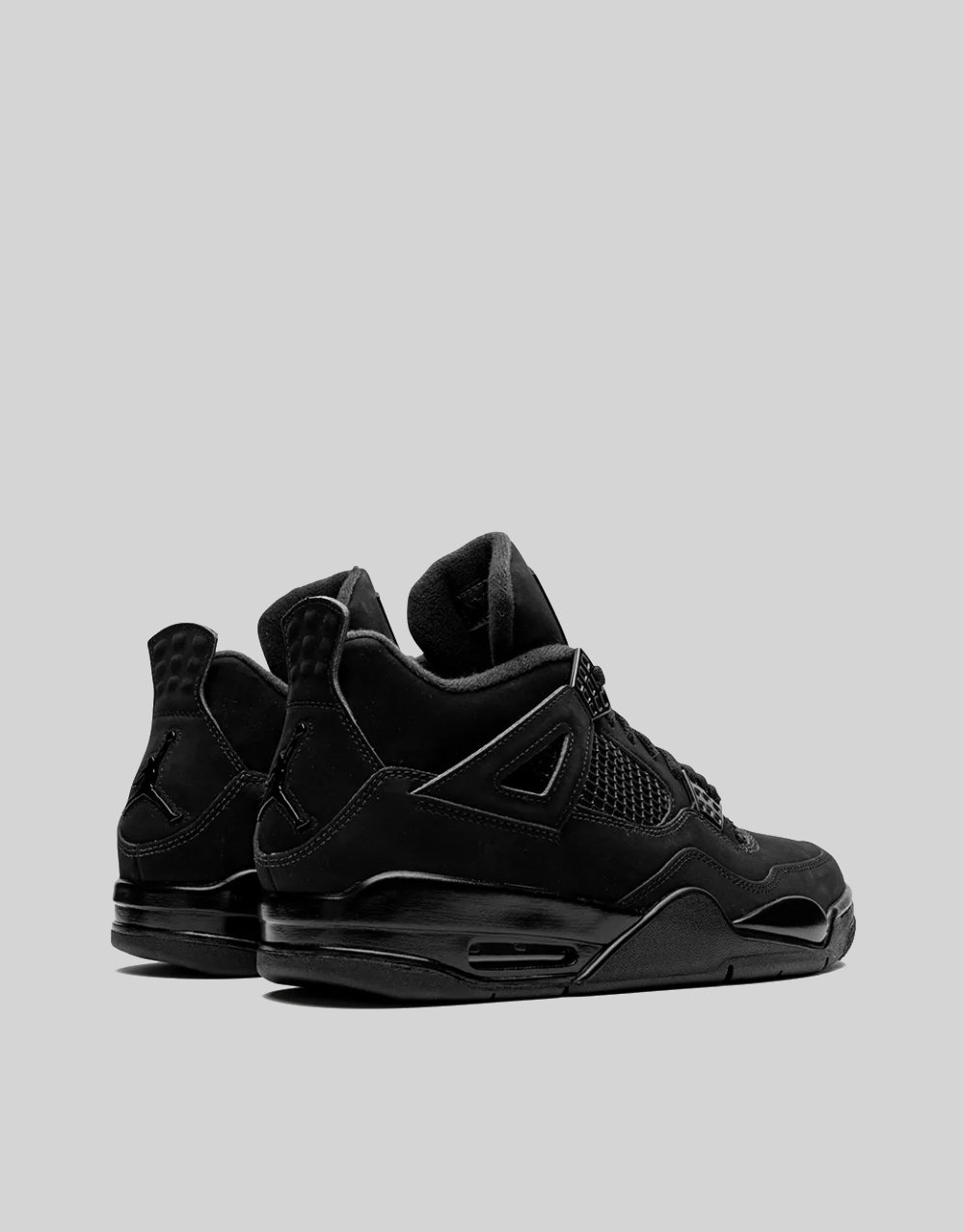 Bottom view of Air Jordan 4 Black Cat showing all-black rubber outsole with white Jumpman logo