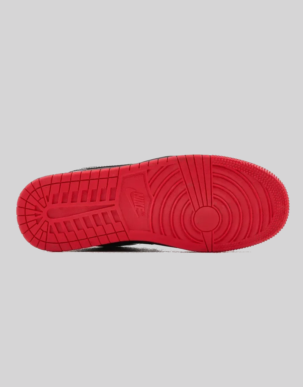 Bottom view of Air Jordan 1 Low SP Gina showing full red herringbone rubber outsole with Nike logo