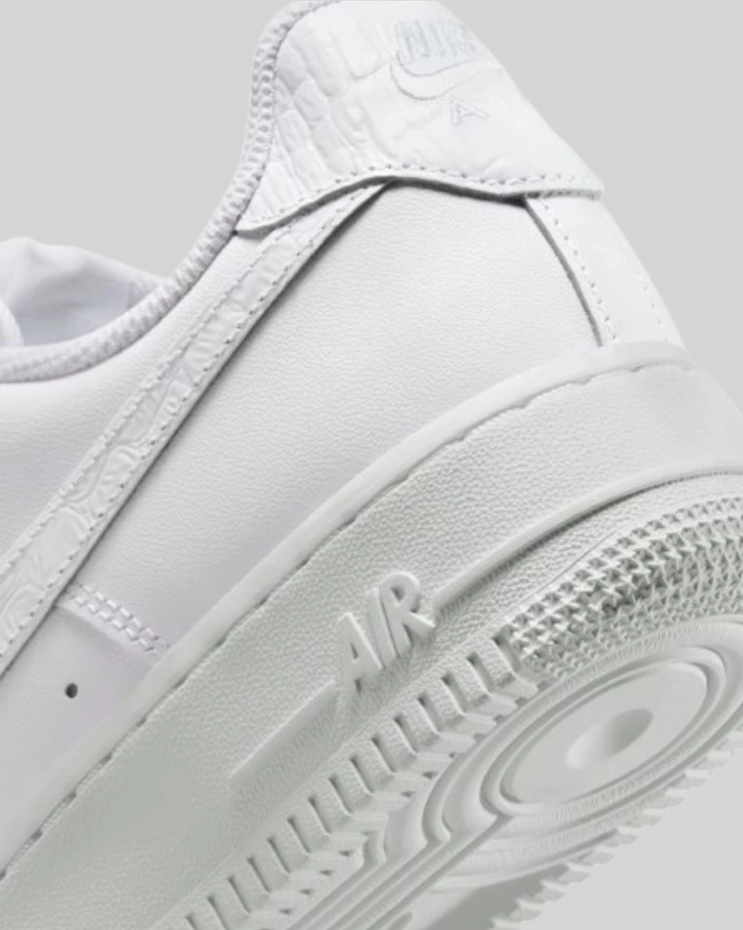 Close-up Nike Air Force 1 07 black perforated leather toe box AF1 metal lace detail