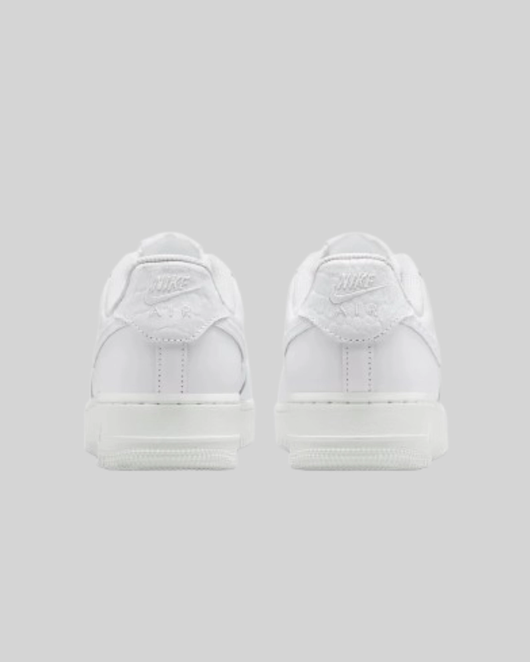 Nike Air Force 1 07 Low black — back heel view pair Nike Air logo detail