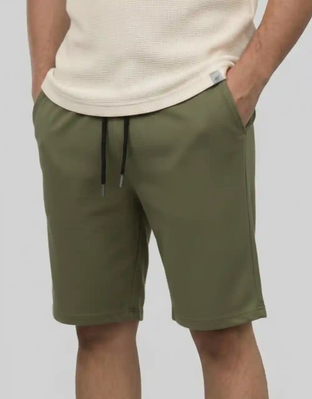 Men's military green basic cotton shorts worn on model front view showing regular fit