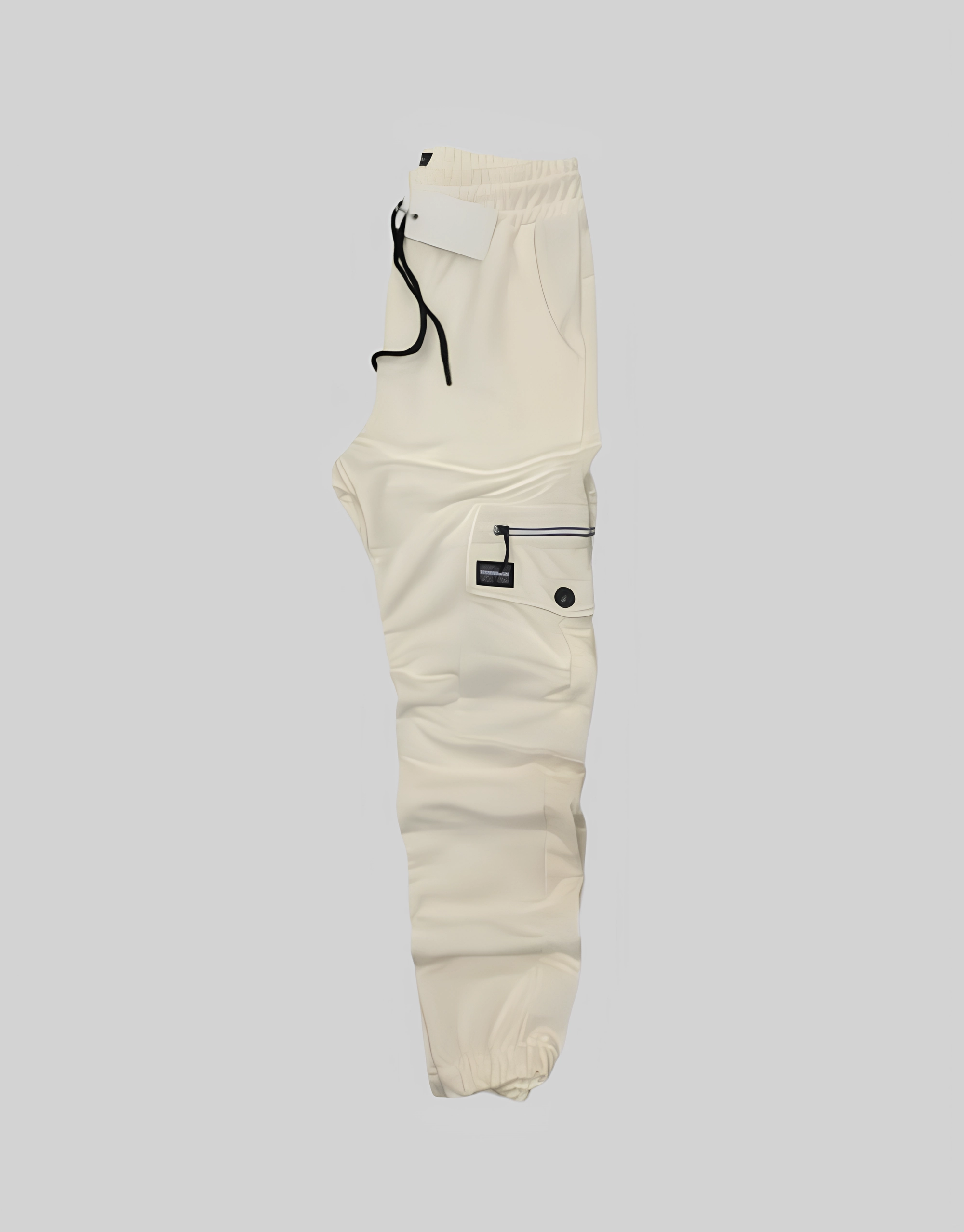 Flat side view of men's écru cotton lycra cargo jogger pants with black zippered thigh pocket and tapered ankle cuff