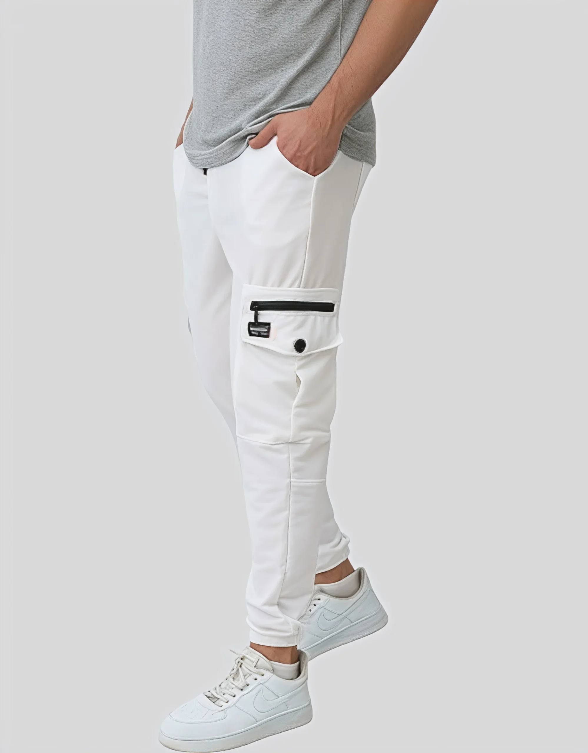 Flat side view of men's white cotton lycra cargo jogger pants showing 6-pocket design and elastic waistband