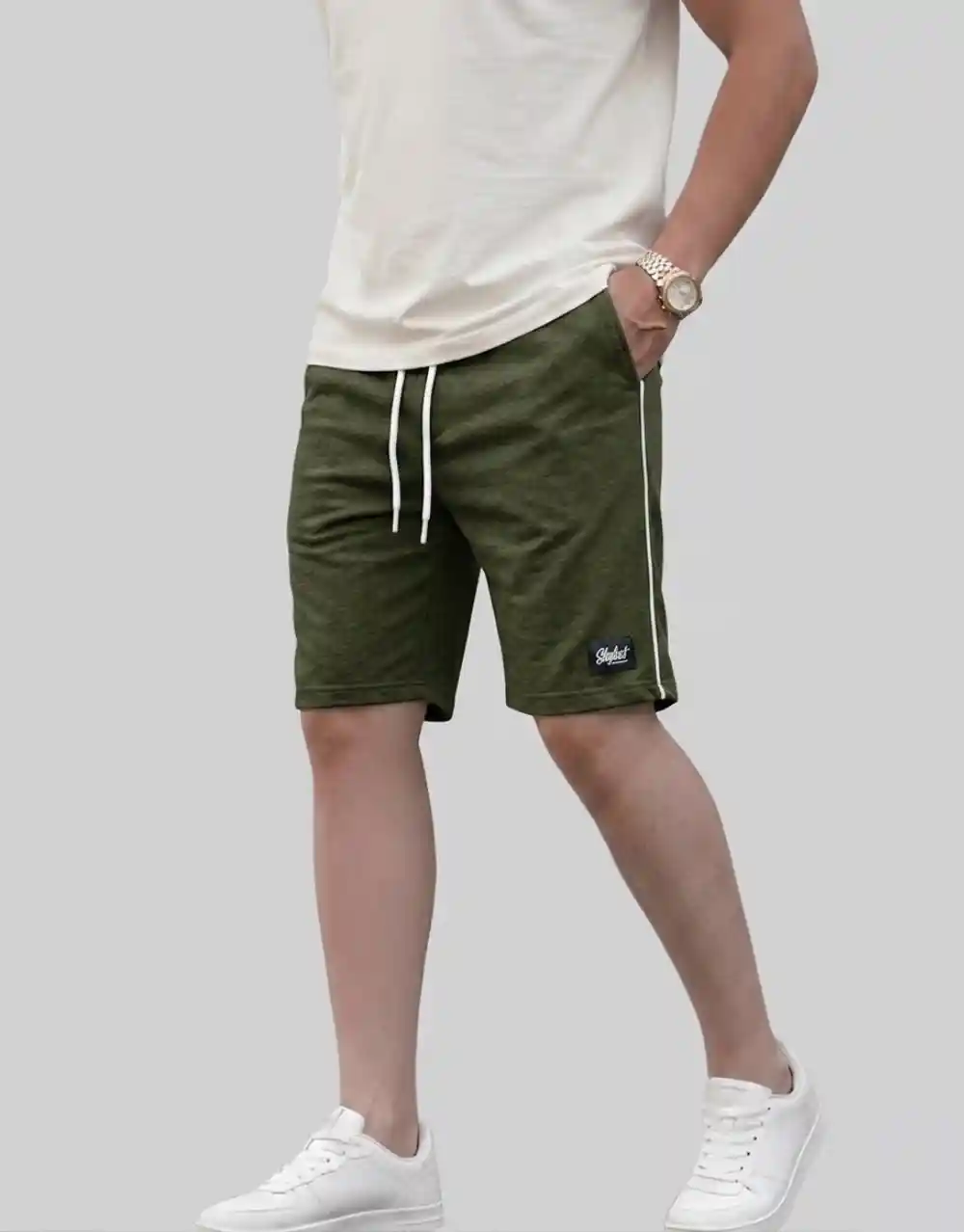 Men's military green cotton shorts with white side piping worn on model side view